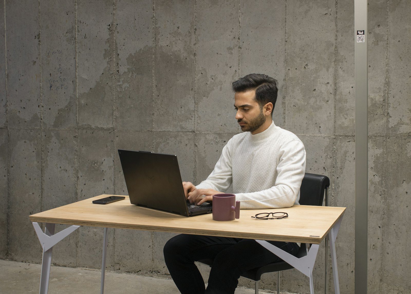 Professional developer building a client project on a laptop