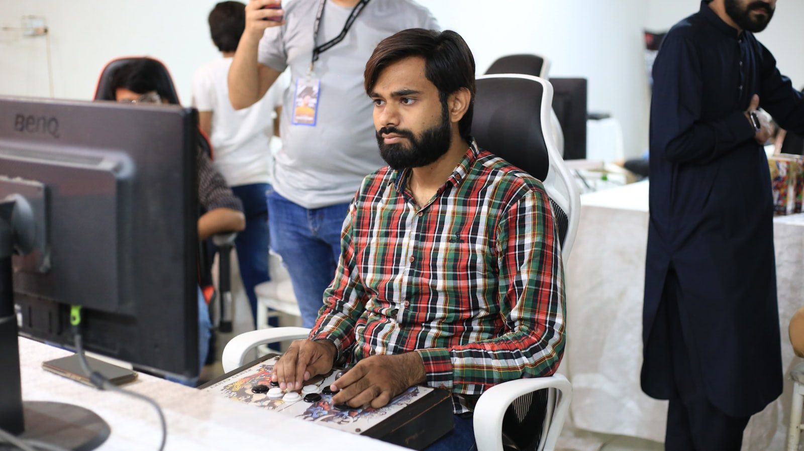 IT engineer managing systems from a multi-monitor workstation